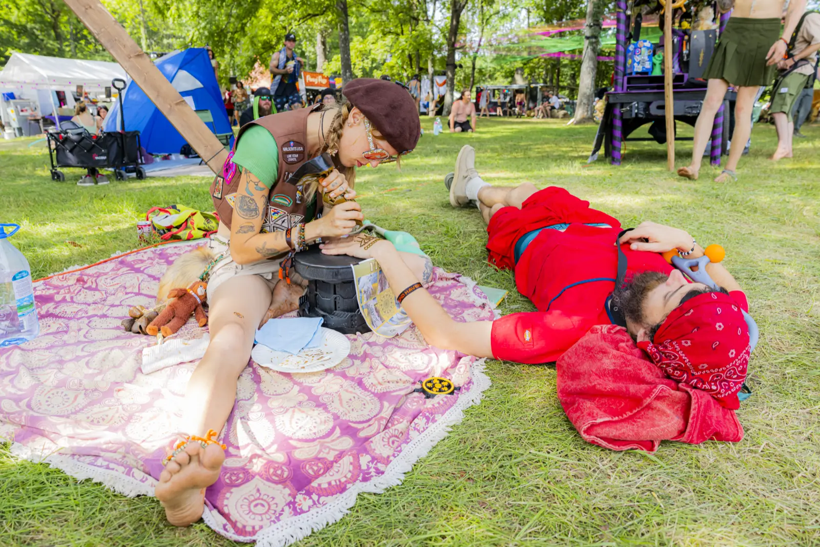 Friends on blankets in the shade at Sound Haven